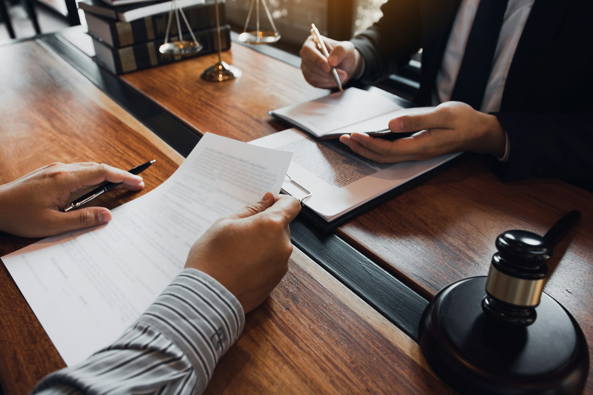 Lawyer is providing information about the client's trial at the lawyer office.